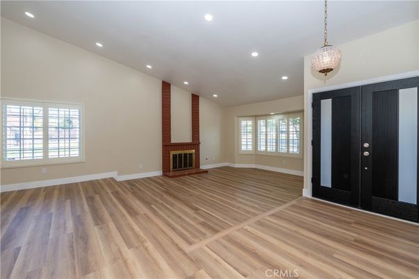 Empty room, Fireplace, Interior, Pendant Lights, Recessed Lighting, Wood Texture Flooring