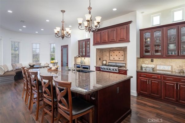 Chandelier, Interior, Kitchen, Living room, Recessed Lighting, Stainless Steel Appliances, Wood Texture Flooring