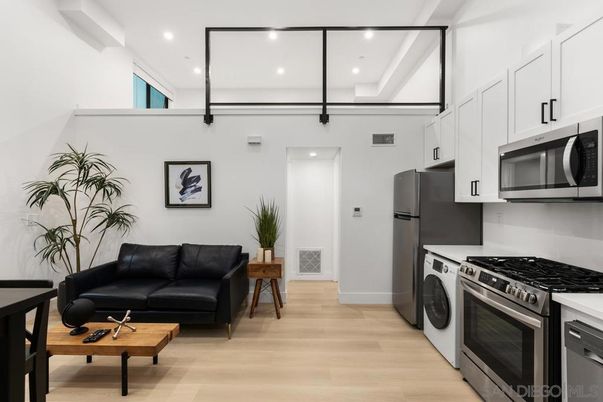 Interior, Kitchen, Recessed Lighting, Stainless Steel Appliances, Washer, Wood Texture Flooring