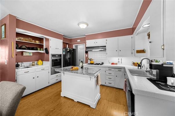 Interior, Kitchen, Stainless Steel Appliances, Tile Countertops, Wood Texture Flooring