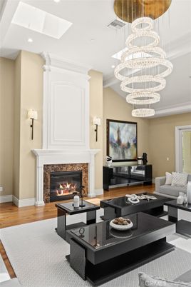 Chandelier, Fireplace, Interior, Living room, Pendant Lights, Recessed Lighting, Wood Texture Flooring