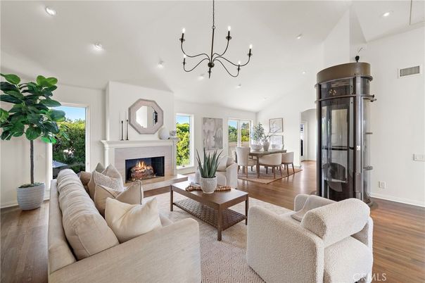 Chandelier, Dining room, Fireplace, Interior, Living room, Recessed Lighting, Wood Texture Flooring