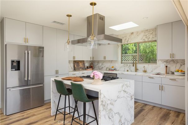 Interior, Kitchen, Marble Walls, Pendant Lights, Recessed Lighting, Stainless Steel Appliances, Wood Texture Flooring