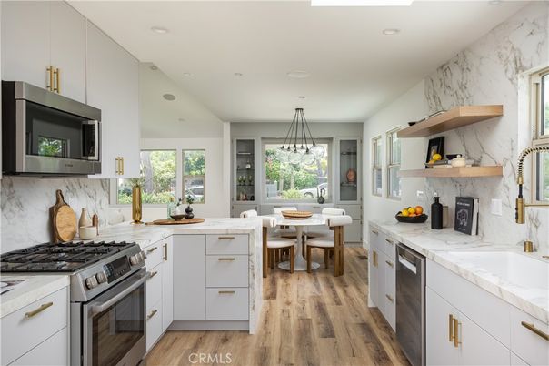 Dining room, Interior, Kitchen, Marble Walls, Pendant Lights, Recessed Lighting, Stainless Steel Appliances, Wood Texture Flooring