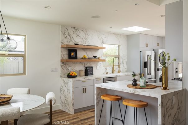 Dining room, Interior, Kitchen, Marble Walls, Pendant Lights, Recessed Lighting, Stainless Steel Appliances, Wood Texture Flooring