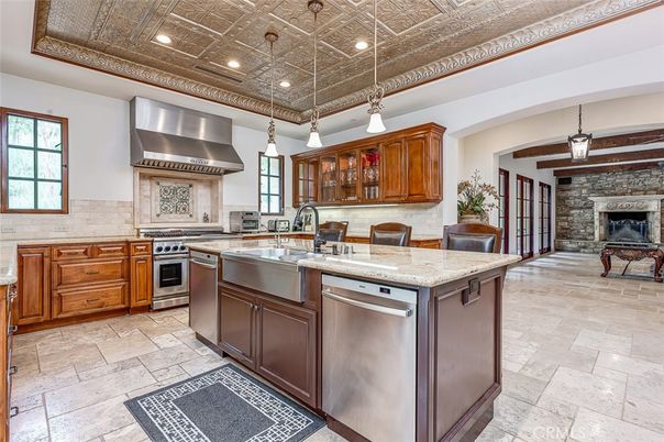 Fireplace, Interior, Kitchen, Pendant Lights, Recessed Lighting, Stainless Steel Appliances, Stone Walls