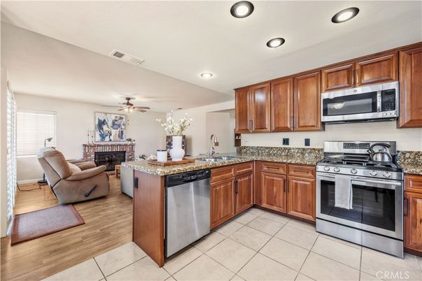 Fireplace, Interior, Kitchen, Living room, Recessed Lighting, Stainless Steel Appliances, Wood Texture Flooring