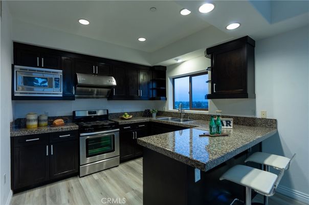 Interior, Kitchen, Recessed Lighting, Stainless Steel Appliances, Water, Wood Texture Flooring