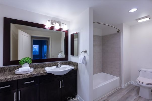 Bathroom, Dual Sink Vanities, Interior, Recessed Lighting, Wood Texture Flooring