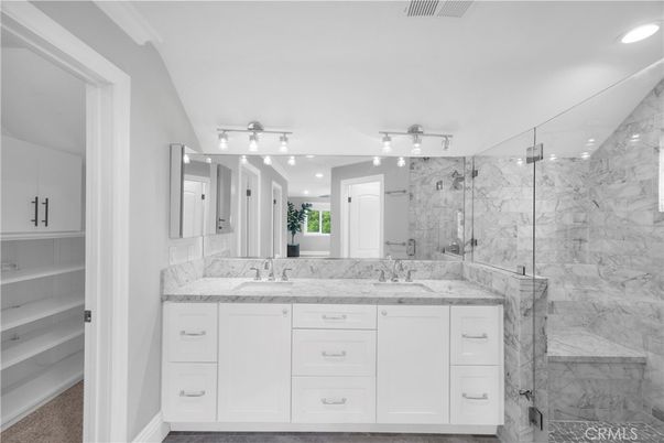 Bathroom, Dual Sink Vanities, Glass Shower, Interior, Marble Walls, Recessed Lighting