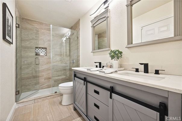Bathroom, Dual Sink Vanities, Glass Shower, Interior, Wood Texture Flooring
