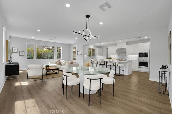 Dining room, Interior, Kitchen, Living room, Pendant Lights, Recessed Lighting, Stainless Steel Appliances, Wood Texture Flooring