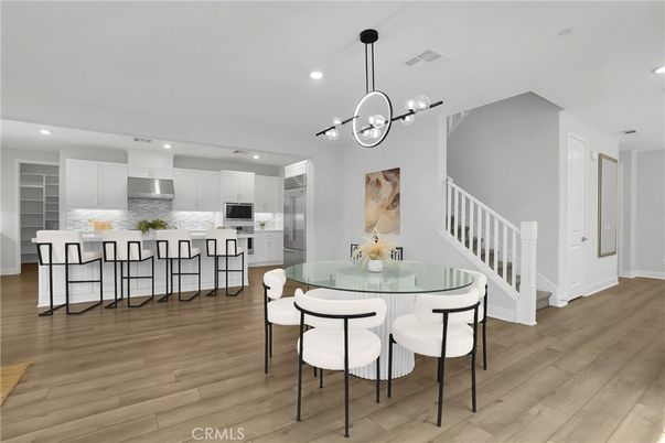 Dining room, Interior, Kitchen, Pendant Lights, Recessed Lighting, Stainless Steel Appliances, Wood Texture Flooring