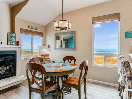 Dining room, Fireplace, Interior, Pendant Lights, Water, Wood Texture Flooring