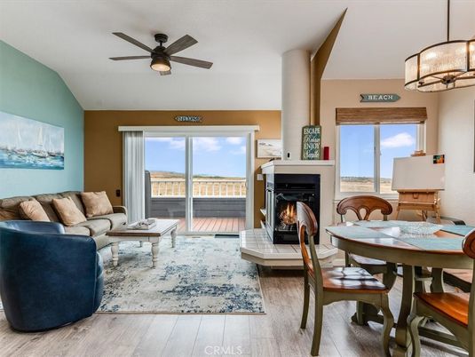 Dining room, Fireplace, Interior, Living room, Pendant Lights, Water, Wood Texture Flooring