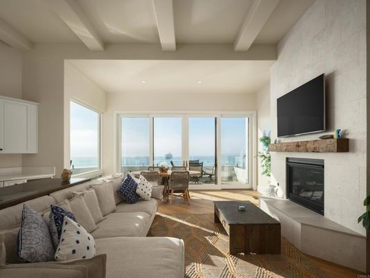 Dining room, Fireplace, Interior, Living room, Recessed Lighting, Stone Walls, Water, Wood Texture Flooring
