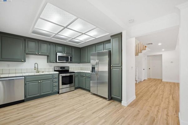 Interior, Kitchen, Recessed Lighting, Stainless Steel Appliances, Wood Texture Flooring