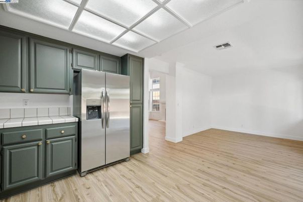 Interior, Kitchen, Stainless Steel Appliances, Tile Countertops, Wood Texture Flooring