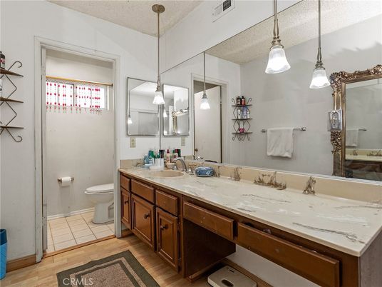 Bathroom, Dual Sink Vanities, Interior, Pendant Lights, Wood Texture Flooring