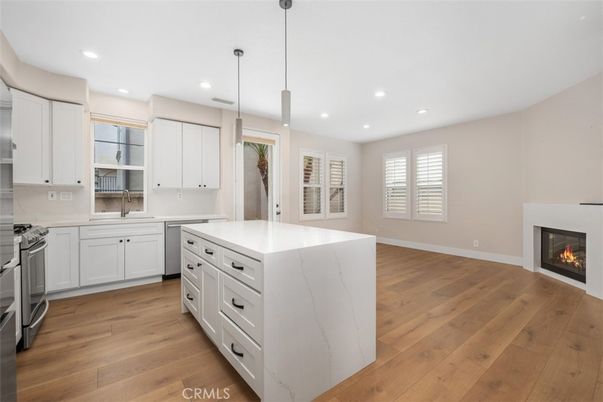 Fireplace, Interior, Kitchen, Pendant Lights, Recessed Lighting, Stainless Steel Appliances, Wood Texture Flooring