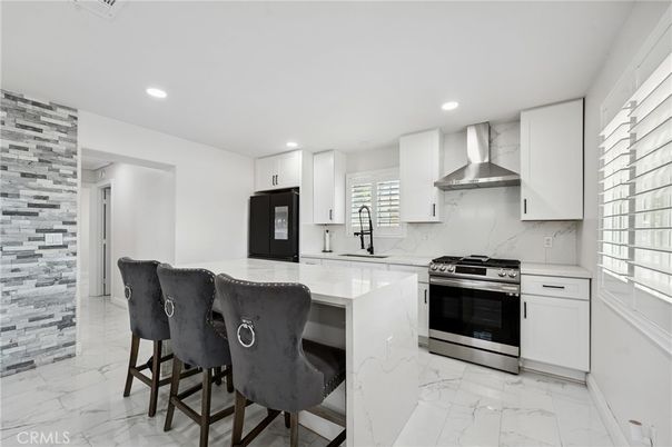 Interior, Kitchen, Marble, Marble Walls, Recessed Lighting, Stainless Steel Appliances, Stone Walls