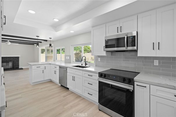 Fireplace, Interior, Kitchen, Pendant Lights, Recessed Lighting, Stainless Steel Appliances, Wood Texture Flooring