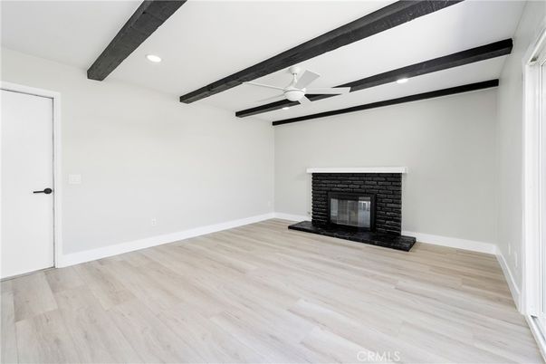 Empty room, Fireplace, Interior, Recessed Lighting, Wooden Beams, Wood Texture Flooring