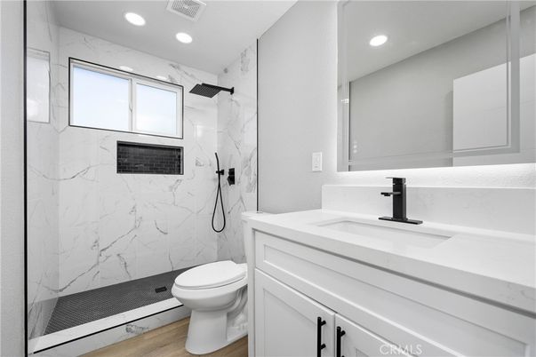 Bathroom, Glass Shower, Interior, Marble Walls, Recessed Lighting, Wood Texture Flooring