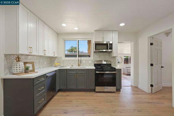 Interior, Kitchen, Recessed Lighting, Stainless Steel Appliances, Wood Texture Flooring