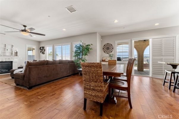 Dining room, Fireplace, Interior, Living room, Recessed Lighting, Wood Texture Flooring