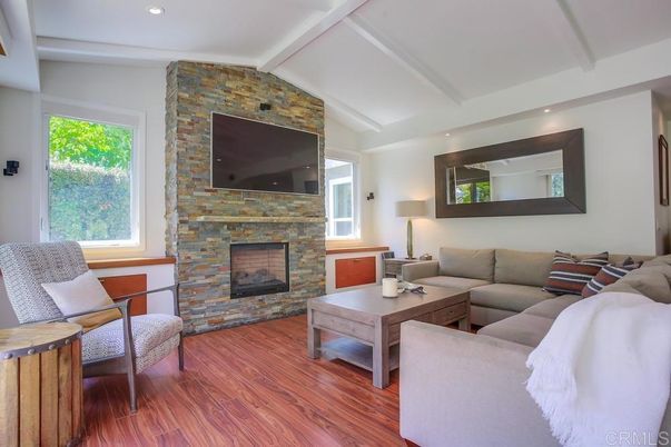 Fireplace, Interior, Living room, Recessed Lighting, Stone Walls, Wood Texture Flooring