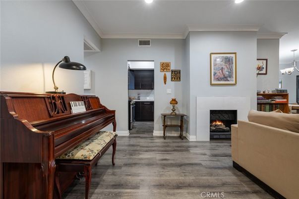 Fireplace, Interior, Living room, Piano, Recessed Lighting, Wood Texture Flooring