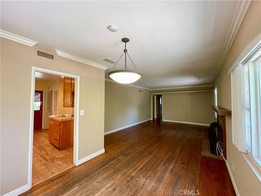 Empty room, Fireplace, Interior, Kitchen, Pendant Lights, Wood Texture Flooring
