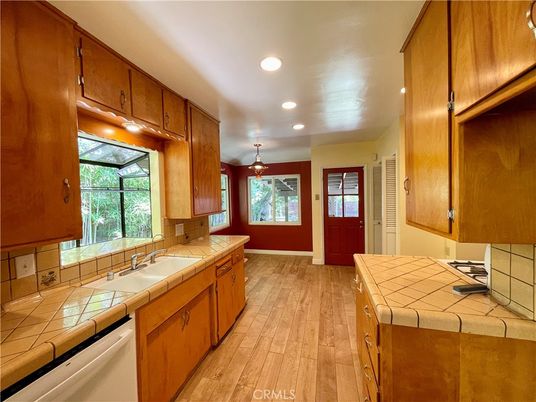Interior, Kitchen, Pendant Lights, Recessed Lighting, Tile Countertops, Wood Texture Flooring