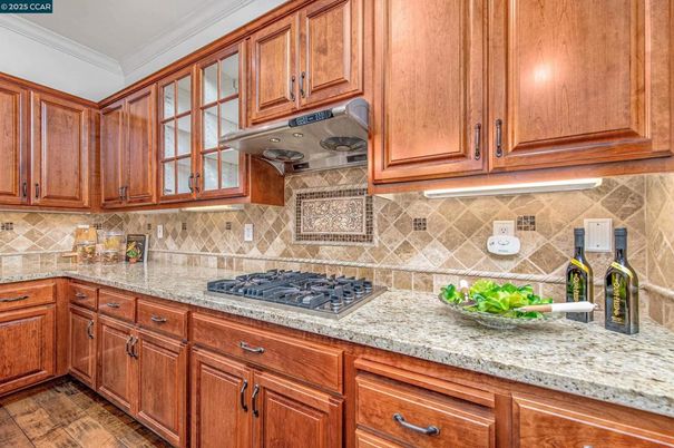Fireplace, Interior, Kitchen, Living room, Pendant Lights, Recessed Lighting, Stainless Steel Appliances, Wood Texture Flooring