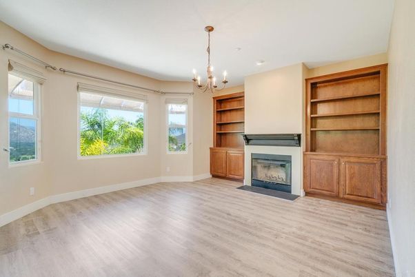 Chandelier, Empty room, Fireplace, Interior, Recessed Lighting, Wood Texture Flooring