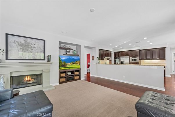 Fireplace, Interior, Kitchen, Recessed Lighting, Stainless Steel Appliances, Wood Texture Flooring
