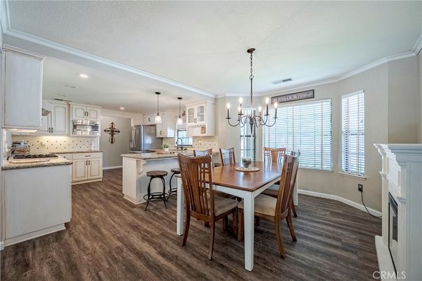 Chandelier, Dining room, Fireplace, Interior, Kitchen, Pendant Lights, Recessed Lighting, Wood Texture Flooring