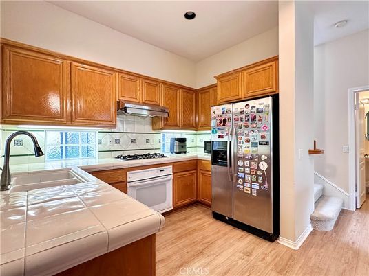 Interior, Kitchen, Recessed Lighting, Tile Countertops, Wood Texture Flooring