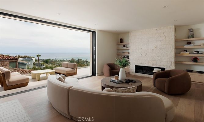 Fireplace, Interior, Living room, Recessed Lighting, Stone Walls, Water, Wood Texture Flooring