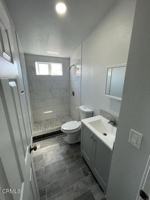 Bathroom, Glass Shower, Interior, Marble Walls, Recessed Lighting, Wood Texture Flooring