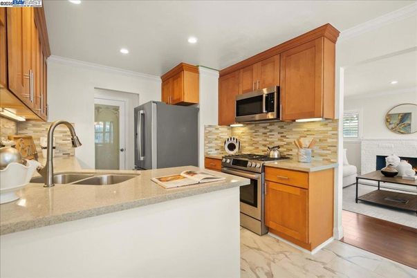 Interior, Kitchen, Marble, Recessed Lighting, Stainless Steel Appliances, Wood Texture Flooring