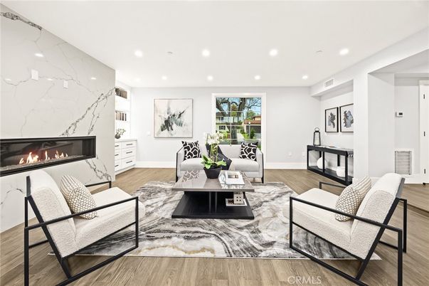 Fireplace, Interior, Living room, Marble Walls, Recessed Lighting, Wood Texture Flooring