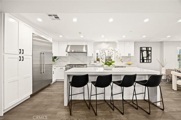 Interior, Kitchen, Marble Walls, Recessed Lighting, Stainless Steel Appliances, Wood Texture Flooring