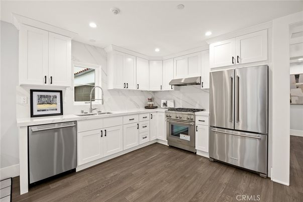 Interior, Kitchen, Marble Walls, Recessed Lighting, Stainless Steel Appliances, Wood Texture Flooring