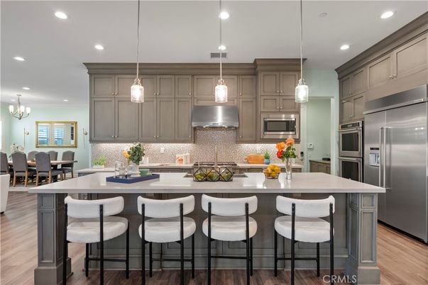 Chandelier, Dining room, Interior, Kitchen, Pendant Lights, Recessed Lighting, Stainless Steel Appliances, Wood Texture Flooring
