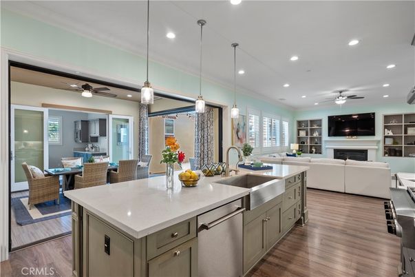 Dining room, Fireplace, Interior, Kitchen, Living room, Pendant Lights, Recessed Lighting, Stainless Steel Appliances, Wood Texture Flooring