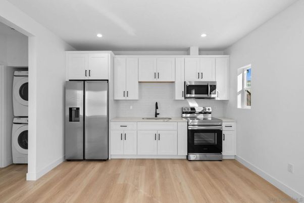 Interior, Kitchen, Recessed Lighting, Stainless Steel Appliances, Washer, Wood Texture Flooring