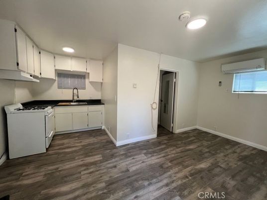 Interior, Kitchen, Recessed Lighting, Washer, Wood Texture Flooring