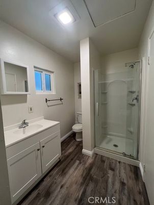Bathroom, Dual Sink Vanities, Glass Shower, Interior, Recessed Lighting, Wood Texture Flooring